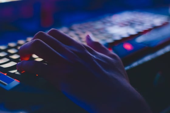 dark-setting-with-hand-on-keyboard